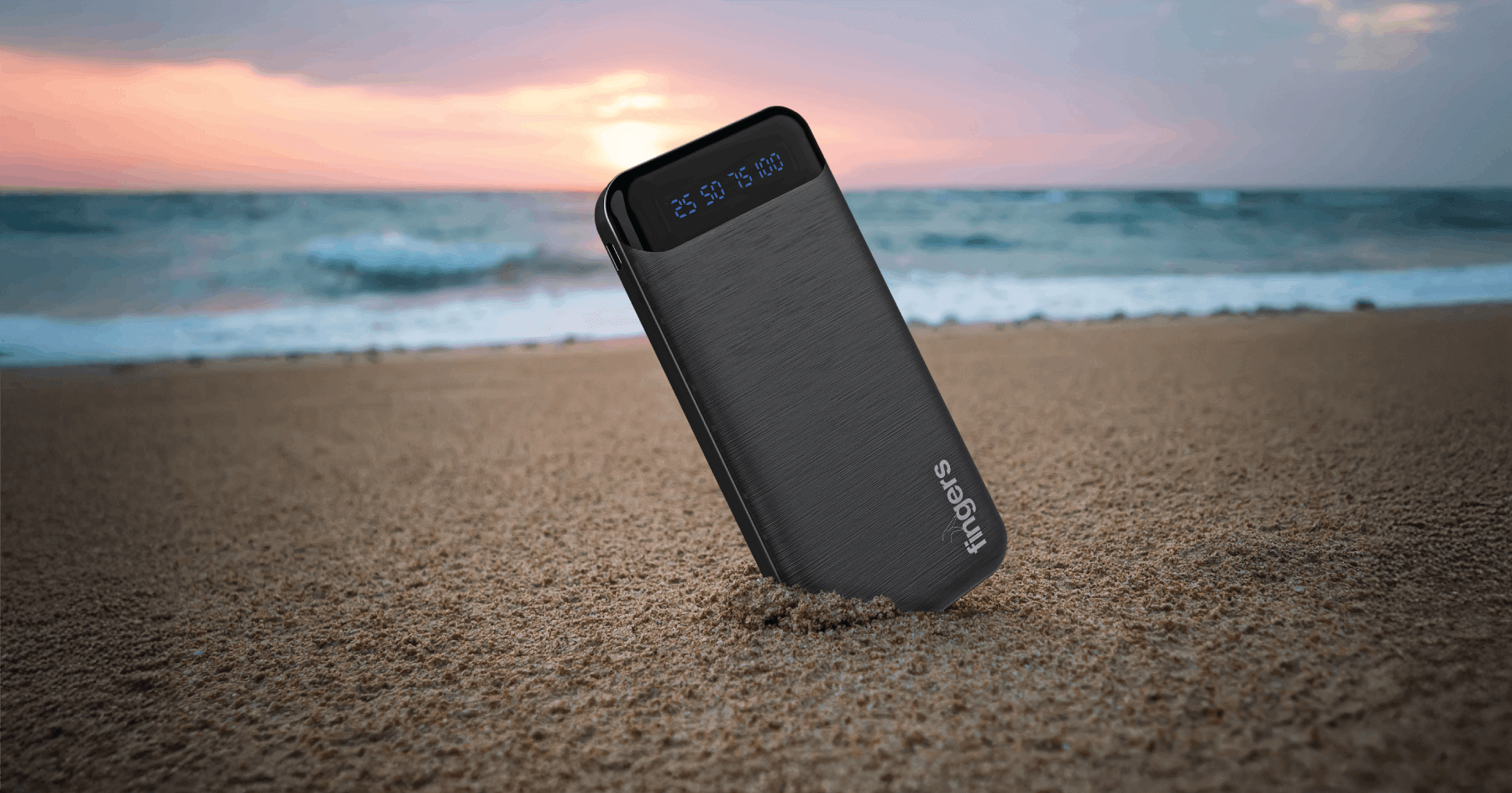 FINGERS Kickstart K15 Black Portable Power Bank Against A Scenic Beach Backdrop
              