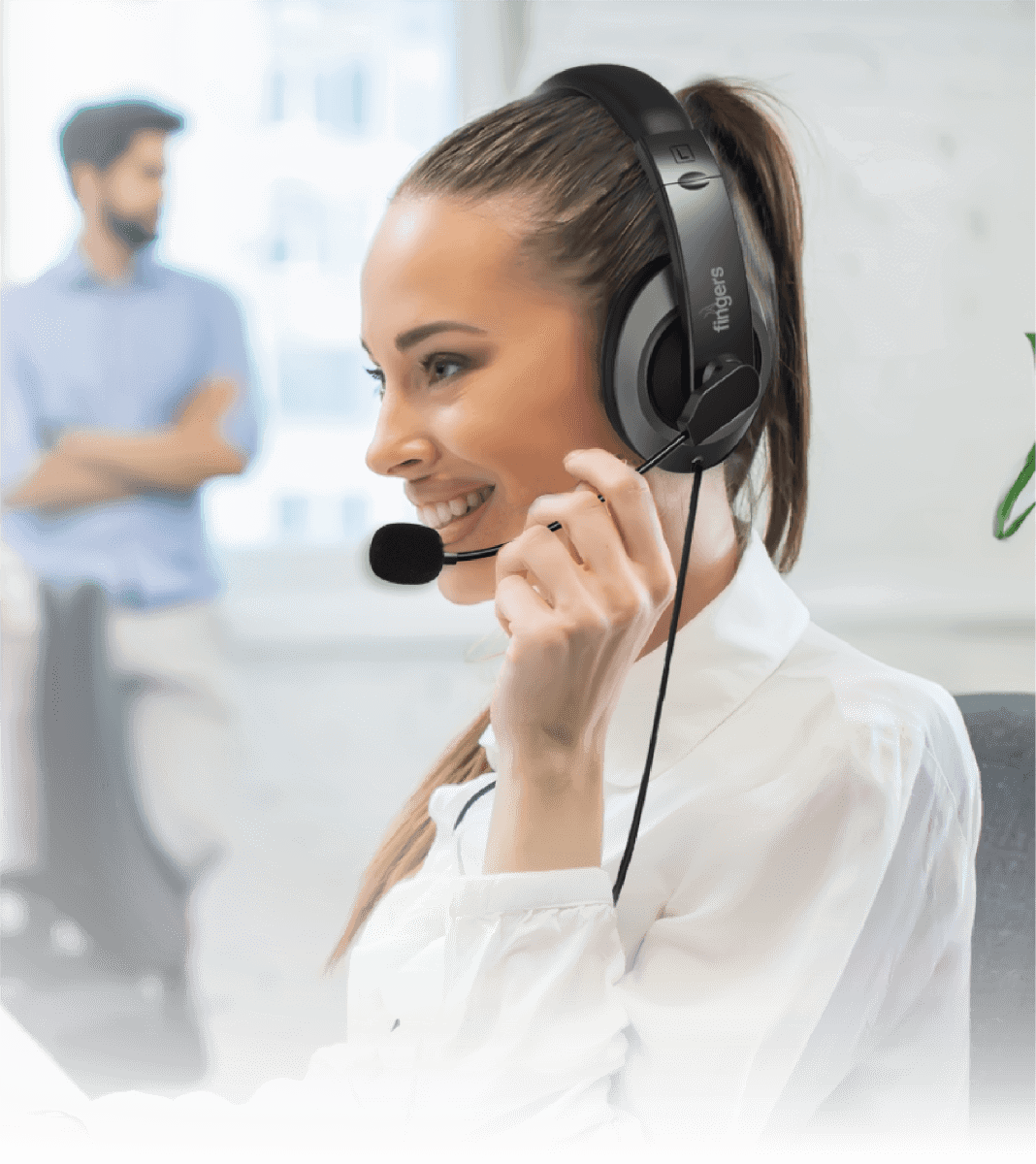 A woman wearing the FINGERS USB Meet H2 wired headset while speaking